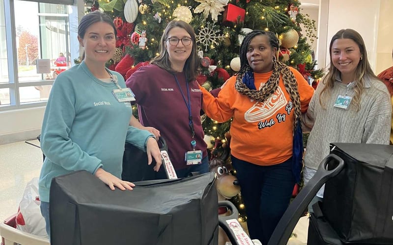 Volunteers providing Christmas meals to patients at Nemours Children Hospital